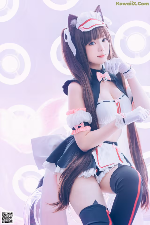 A woman in a maid outfit posing for a picture.