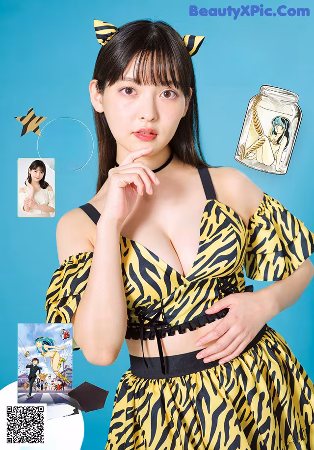 A woman in a yellow and black dress posing for a magazine.